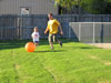 Fighter pilot Jason plays ball with F-61's flight cc's daughter